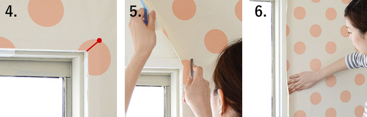 woman installing wallpaper